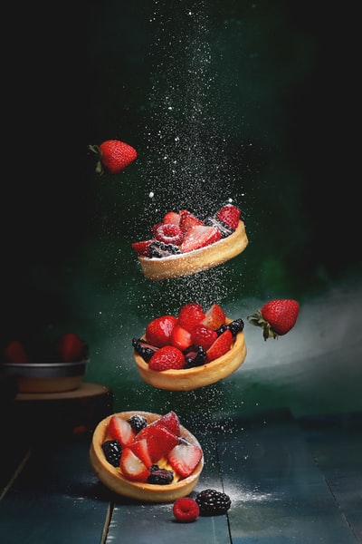 Brown wooden bowl of strawberries
